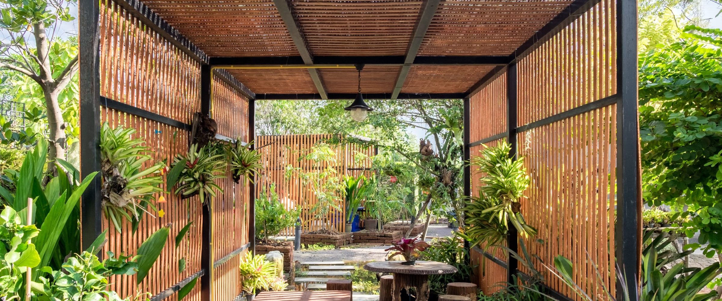 Metal pergola with timber cladding
