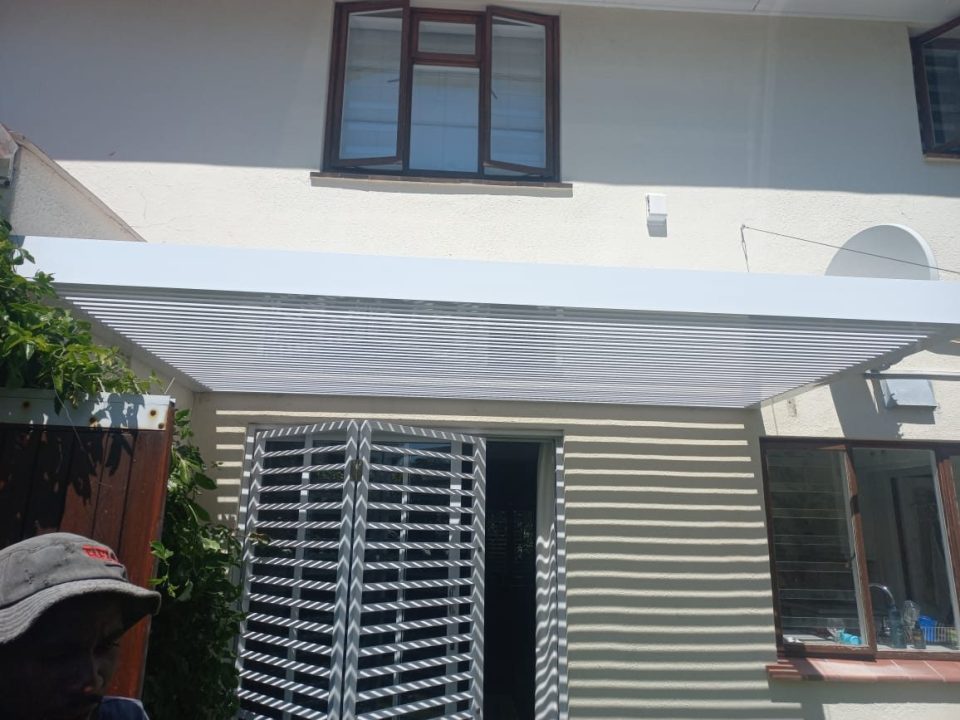 Wire pergola attached to house