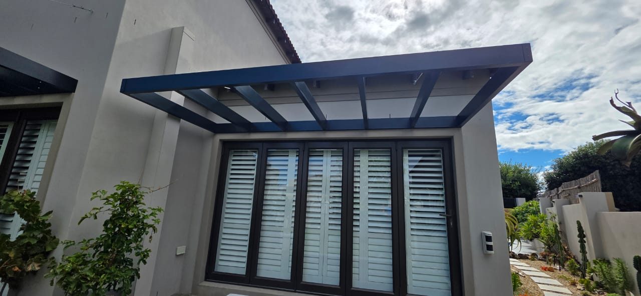 Wire supported pergola with glass roof