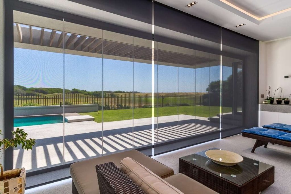 Glass stack away Doors for an outdoor Pergola room Pergola Trends 2026: Smart Shade, Clean Lines & All-Season Outdoor Living, image 6