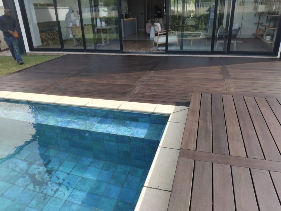 Hardwood deck with manual sliding deck over pool, photo 1