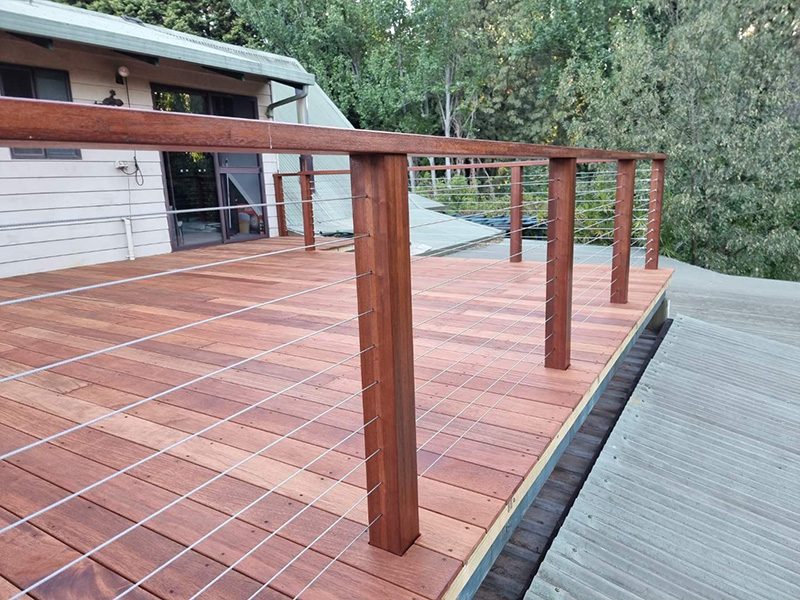 Wire balustrade with timber posts and timber hand rail