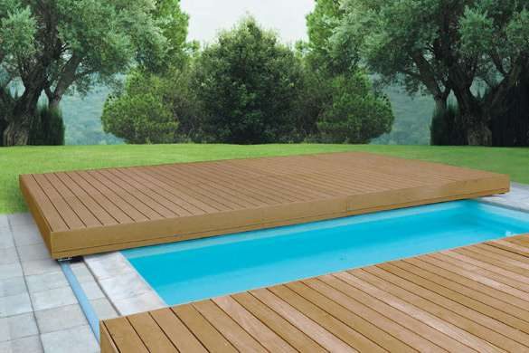 A beautiful pool with a sliding deck cover