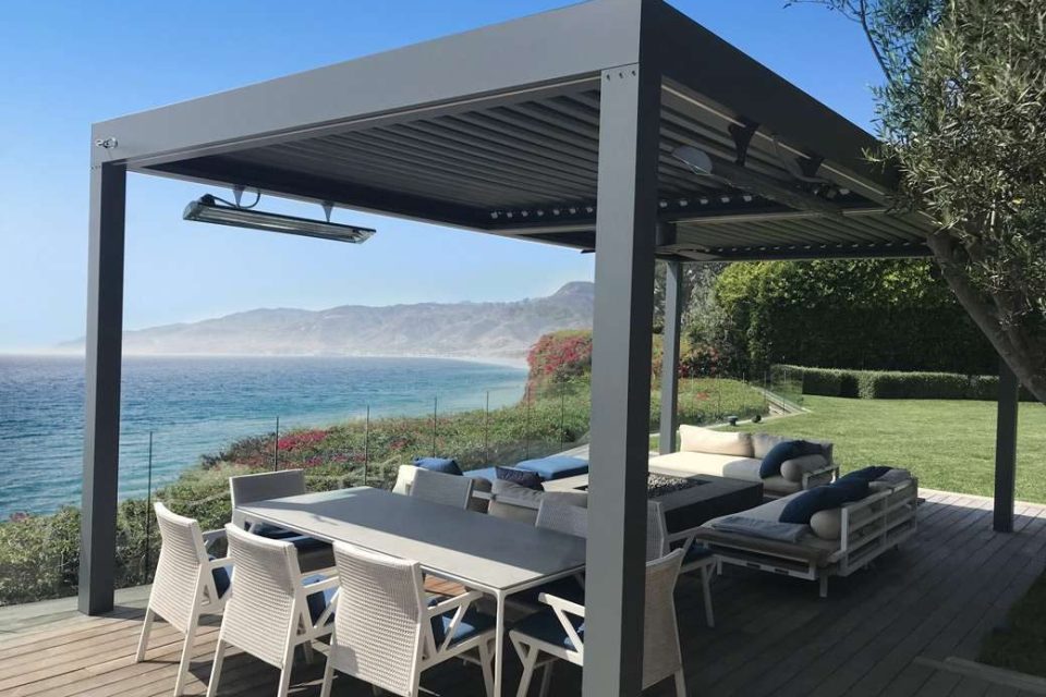 An aluminium pergola with a scenic coastal backdrop